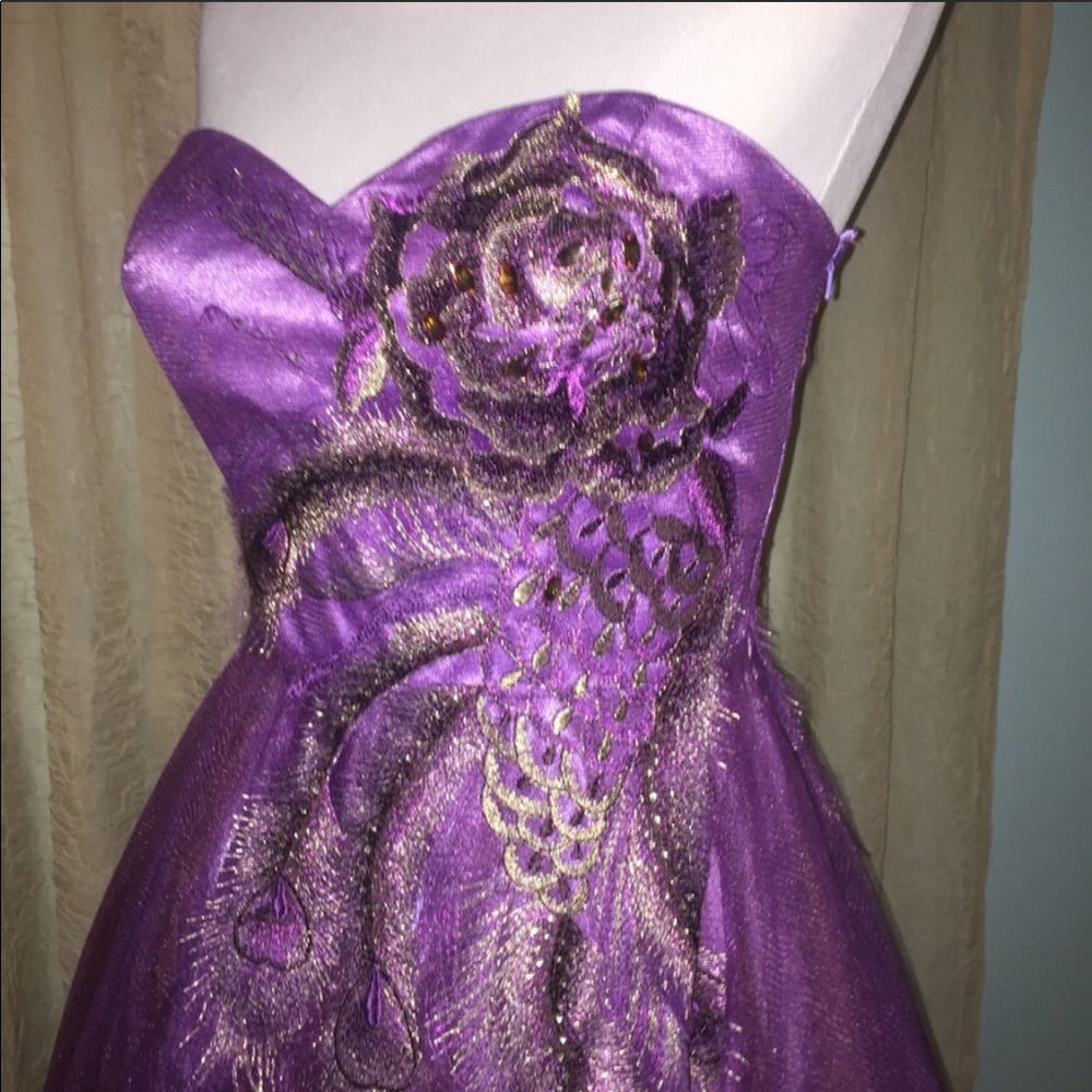 purple dress peacock feather detail